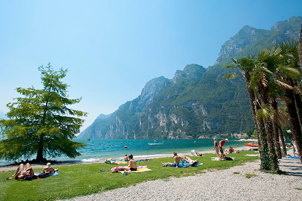 people sunbathing on beach in Riva